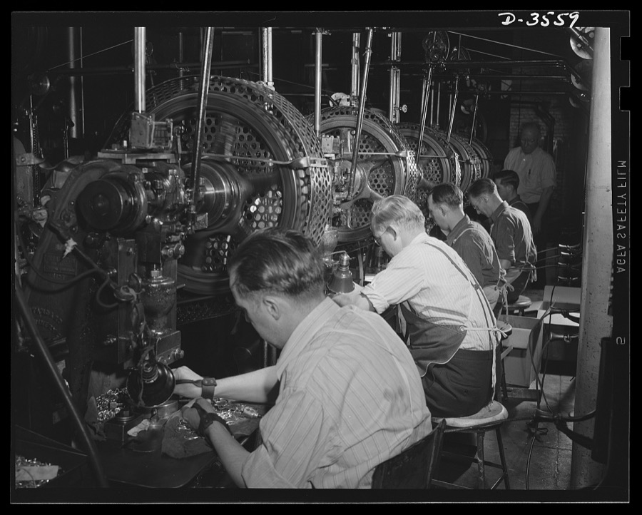 Conversion. Watch cases to war production. Squaring away for war Production. When the last batch of watch cases goes down the line of punch presses at a Kentucky factory, the trained operator will begin turning out compass cases, radio parts and small carbine machine gun parts for our armed forces. Note safety cords on all except second worker. He's die maker seting up a new job. Wadsworth Watch Company, Louisville, Kentucky