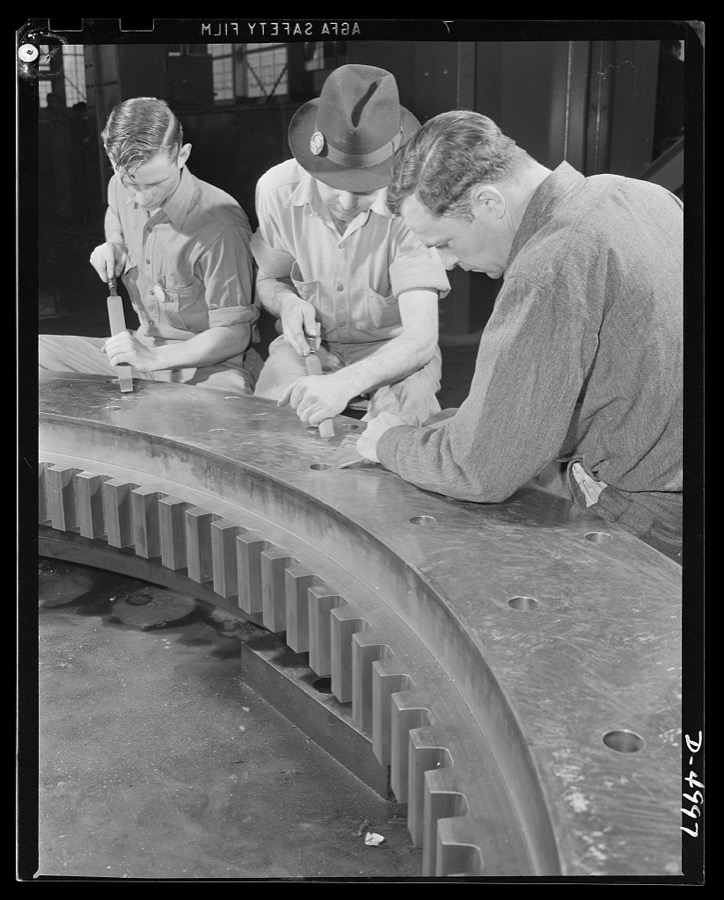 Production. Naval gun mounts. Final finishing of a large naval gun mount is well under way as workmen of a Midwest machine shop do a careful job of scraping surfaces. Westinghouse, Louisville