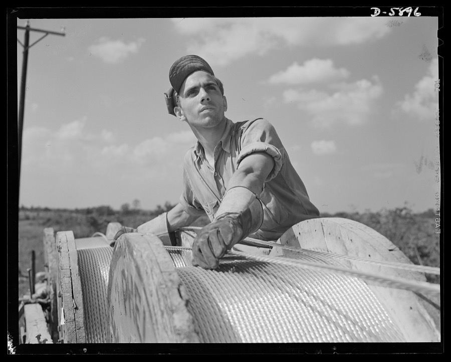 Fort Knox. Electric power line construction. The electrical industry of America relies largely on the "broadback" or lineman, to bring its power to the places where it is needed. This man is working on the construction of a transmission line to Fort Knox, Kentucky, where American soldiers are training for the battles of democracy