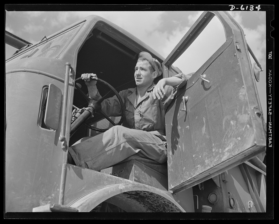 Fort Knox. Bridge construction trucks. Driver of a special bridge truck used by engineer units attached to the armored forces. Equipped with winches and crane members, these trucks make short work of transporting treadway bridge sections and laying them on pontoons. This particular truck is in use at Fort Knox, Kentucky, where soldiers are being trained in the use of armored equipment
