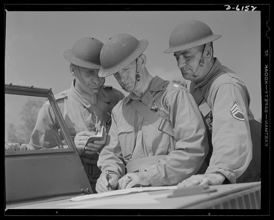 Fort Knox. Armored force personnel. A captain, a lieutenant-colonel and a staff sergeant of the armored forces discuss tactical problems during war games at Fort Knox, Kentucky, where soldiers in training are learning the most up-to-date methods of fighting a mechanized war