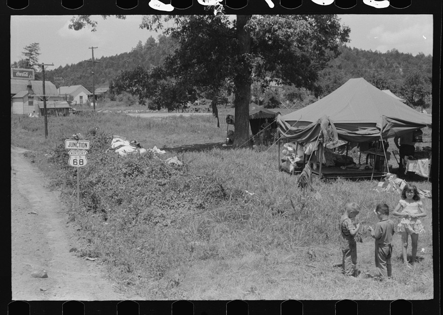 Itinerant repair man with family who goes around to the different farmers to mend their stoves. Near Lawrenceburg, Kentucky
