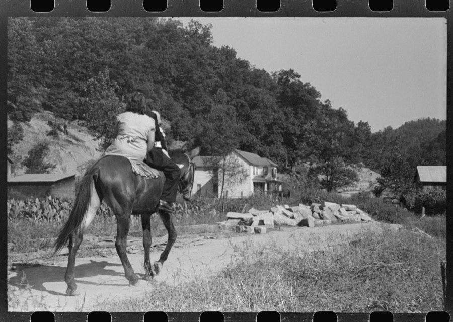 Relatives and friends of the family of the deceased going home from a memorial meeting in the mountains near Jackson, Kentucky. See general caption no. 1