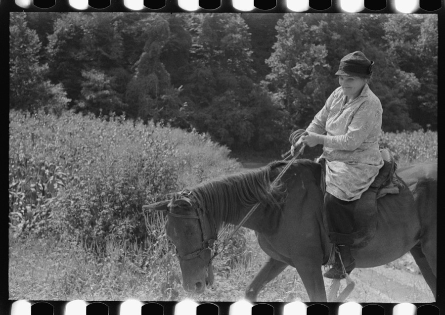 Mountain woman riding to town up Frozen Creek, near Jackson, Breathitt County, Kentucky