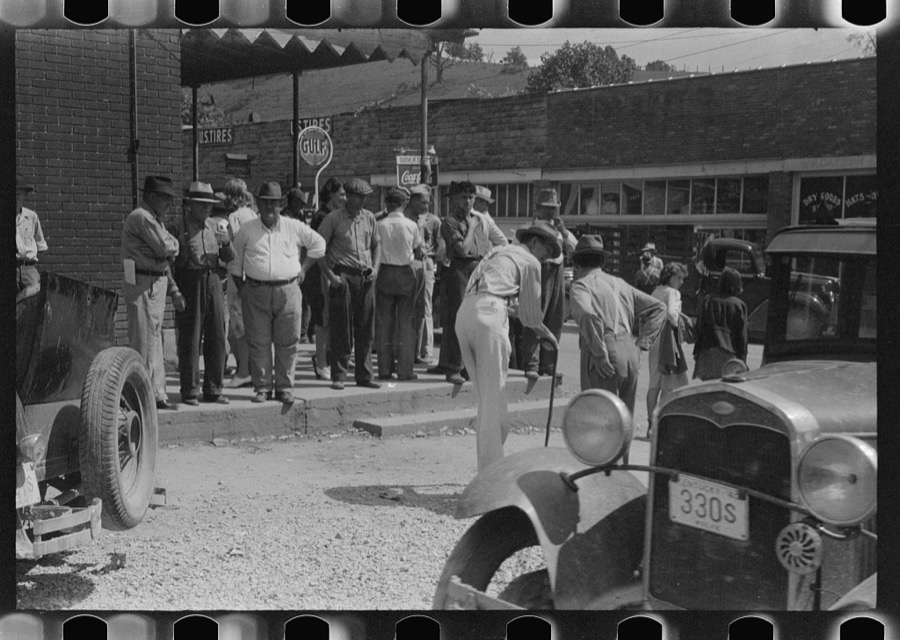 Mountain people exchanging news and greetings on the street corner in center of town on Saurday afternoon and court day. Campton, Wolfe County, Kentucky