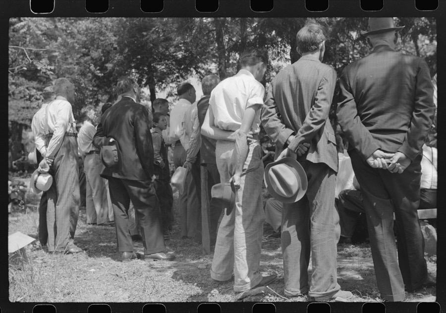 Friends and relatives of the deceased listening to the preacher at an annual memorial meeting. Up Frozen Creek, near Jackson, Breathitt County, Kentucky. See general caption no. 1