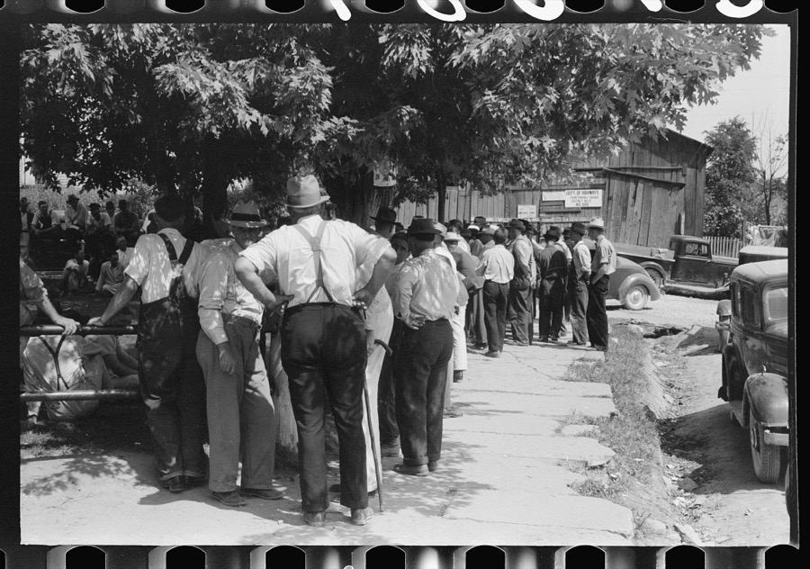 Mountaineers and farmers exchange news near courthouse on court day. Campton, Wolfe County, Kentucky