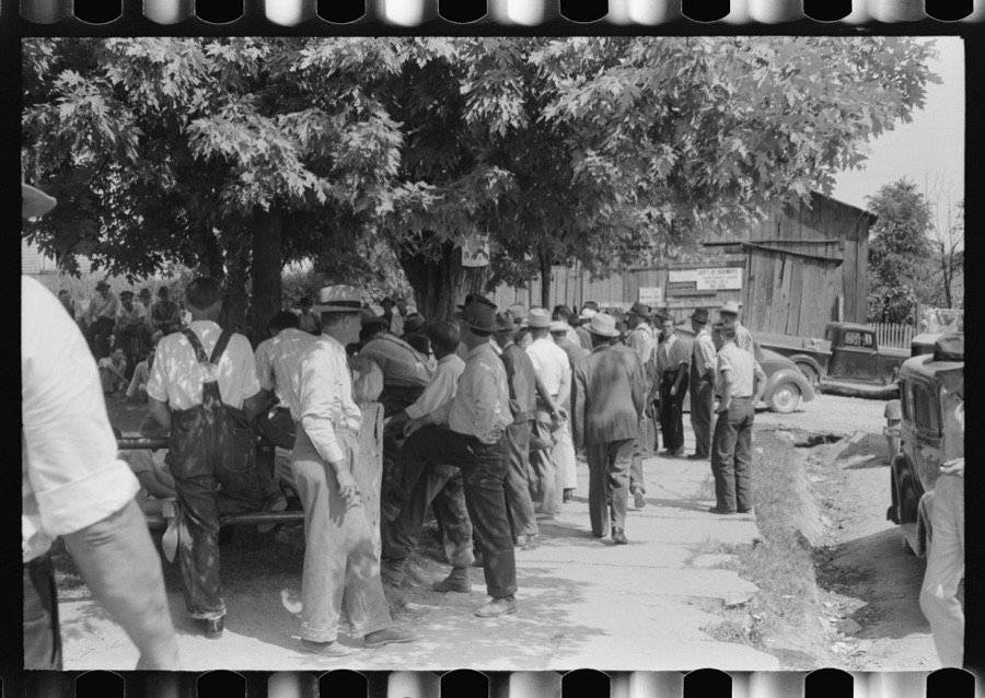 Mountaineers and farmers exchange news near courthouse on court day. Campton, Wolfe County, Kentucky