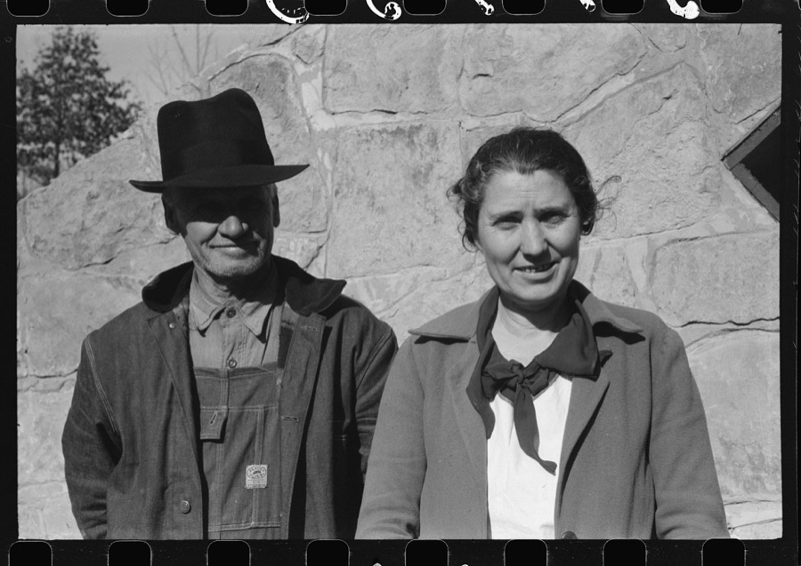 Mr. and Mrs. S. Castle or Mr. and Mrs. William S. Allen standing before their new storage house. Southern Appalachian Project, near Barbourville, Knox County, Kentucky. Mr. and Mrs. S.W. Castle, in front of his new storage house her husband built on their farm, with FSA (Farm Security Administration) help. Southern Appalachian Project, near Barbourville, Knox County, Kentucky
