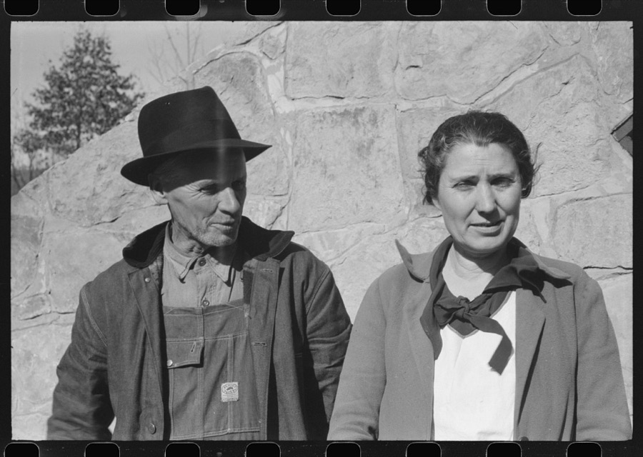 Mr. and Mrs. S. Castle or Mr. and Mrs. William S. Allen standing before their new storage house. Southern Appalachian Project, near Barbourville, Knox County, Kentucky. Mr. and Mrs. S.W. Castle, in front of his new storage house her husband built on their farm, with FSA (Farm Security Administration) help. Southern Appalachian Project, near Barbourville, Knox County, Kentucky