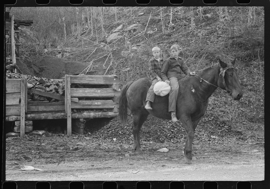 FSA (Farm Security Administration) borrower's children returning home on muleback with a sack of meal. Knox County, Kentucky