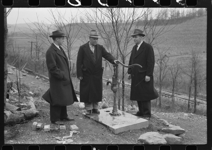 Dr. R.B. Fulks, county health officer, John E. Hale, contractor and builder of sanitary units, and B.H. Pitt, inspector of sanitary units, making a sanitation inspection on the farm of Hobert Hammons, FSA (Farm Security Administration) borrower. Southern Appalachian Project, near Barbourville, Knox County, Kentucky