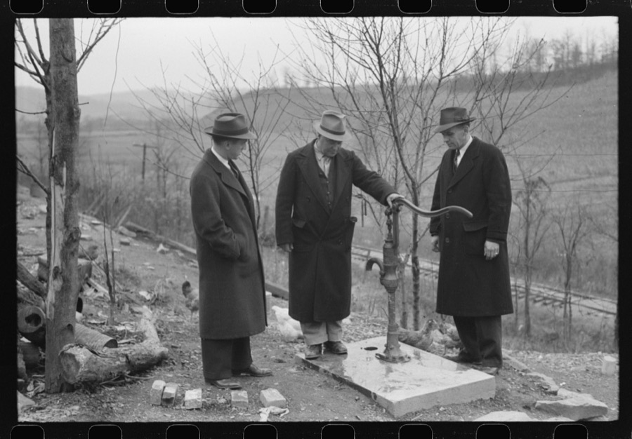 Dr. R.B. Fulks, county health officer, John E. Hale, contractor and builder of sanitary units, and B.H. Pitt, inspector of sanitary units, making a sanitation inspection on the farm of Hobert Hammons, FSA (Farm Security Administration) borrower. Southern Appalachian Project, near Barbourville, Knox County, Kentucky