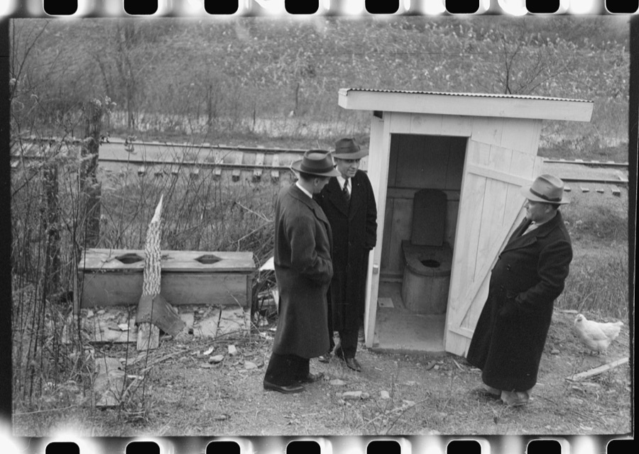 Dr. R.B. Fulks, county health officer, John E. Hale, contractor and builder of sanitary units, and B.H. Pitt, inspector of sanitary units, making a sanitation inspection on the farm of Hobert Hammons, FSA (Farm Security Administration) borrower. Southern Appalachian Project, near Barbourville, Knox County, Kentucky