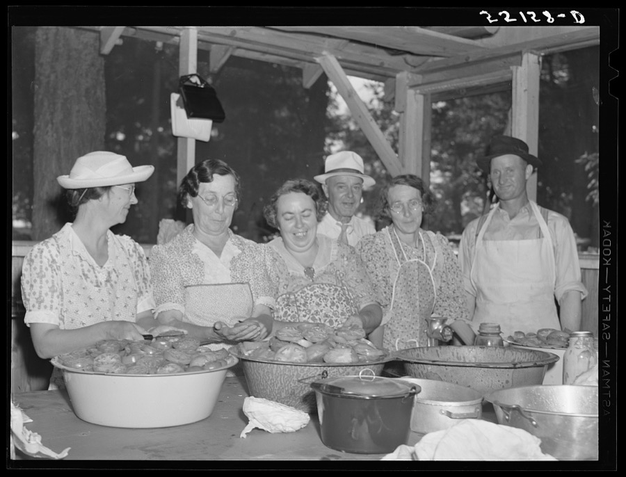 Parishioners peeling and slicing tomatoes for a benefit picnic supper on the grounds of Saint Thomas' Church. Near Bardstown, Kentucky
