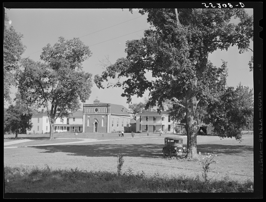 Church and rectory on the grounds of Saint Thomas' Church where a picnic is to be held. Near Bardstown, Kentucky