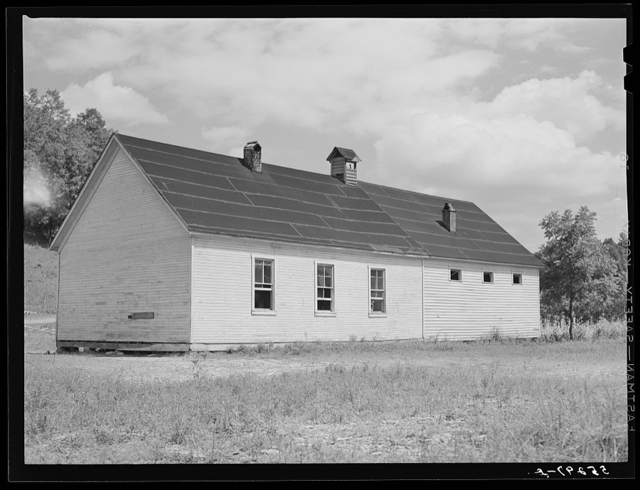 Two-room school house near Morehead, Kentucky. In these mountain areas the school term begins in June and goes through January, because in the late winter and spring months the weather is so severe and roads so bad and children's' clothing is too inadequate