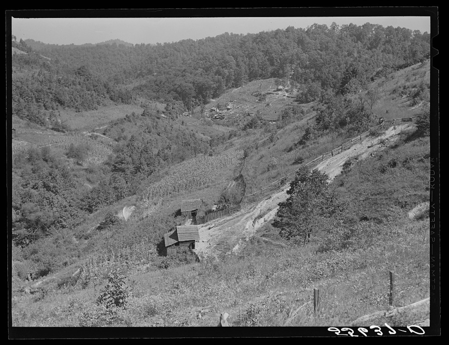 General landscape near Hyden, Kentucky showing mountain cabins, sheds and cornfields