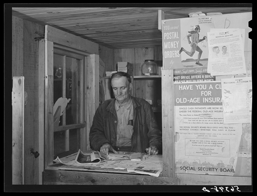 Mr. S.H. Castle in the post office inside his store by his home. Southern Appalachian Project near Barbourville, Knox County, Kentucky