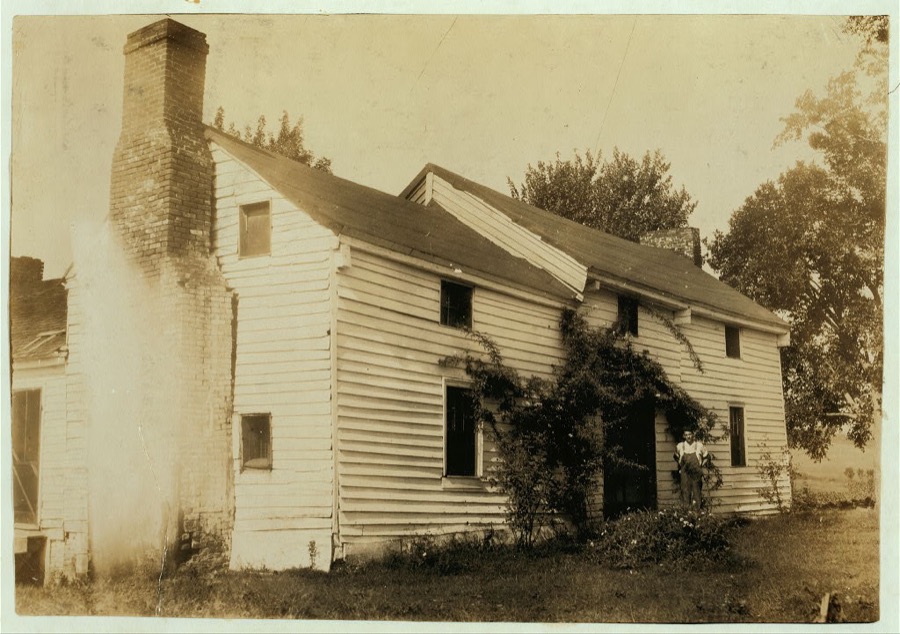 Home of Wyatt Pruett (in doorway). His father is a prosperous farmer but the boy stays out of school to work. Will go to Pruett School.  Location: Henderson County--Hebbardsville [vicinity], Kentucky