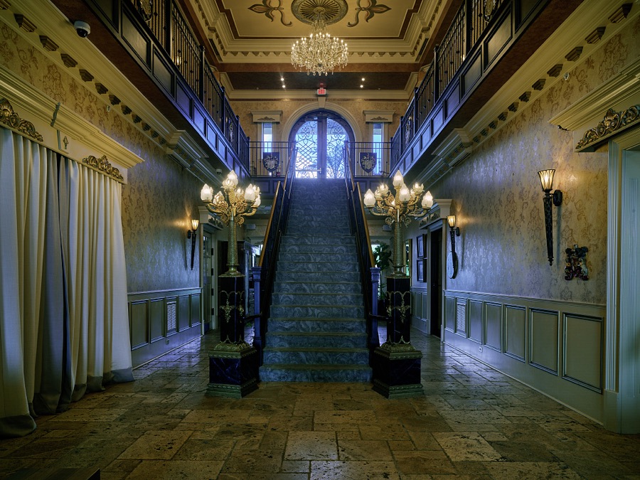 Grand staircase inside The Castle, a luxury hotel and spa built in 1950 as a private residence near Versailles, Kentucky