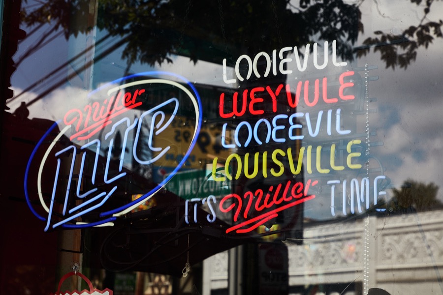 Sign in a store window in the lively Highlands Neighborhood of Louisville, Kentucky's largest city, which highlights three of the common pronunciations, or mispronunciations, depending upon who is hearing them, of the city name