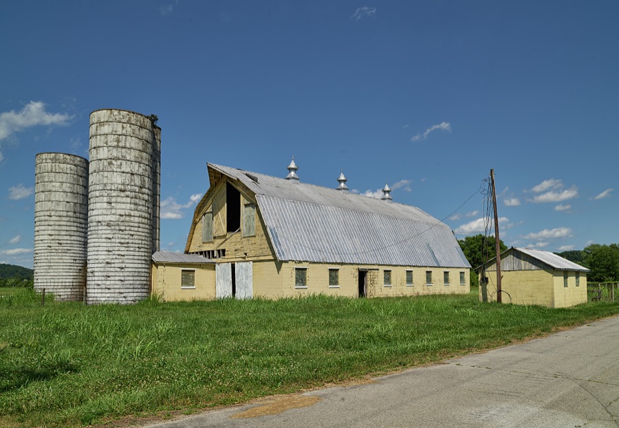 An abandoned dairy barn and silos on the outskirts of Carrollton, Kentucky