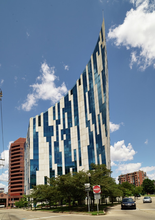 The modernist and highly unusual Ascent Building, a curved apartment building that comes to a sharp point overlooking the John A. Roebling Suspension Bridge on the Covington, Kentucky, side of the Ohio River, across from Cincinnati