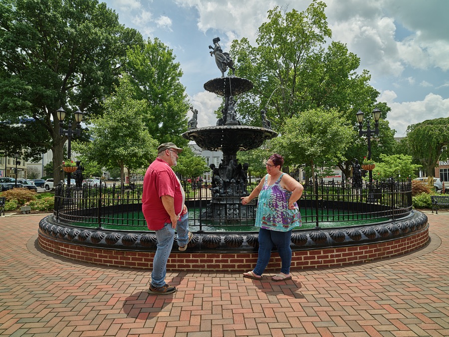 Bowling Greeners Rob Tabor and his wife, Robbie Wright-Tabor, converse at Fountain Square in Bowling Green, Kentucky