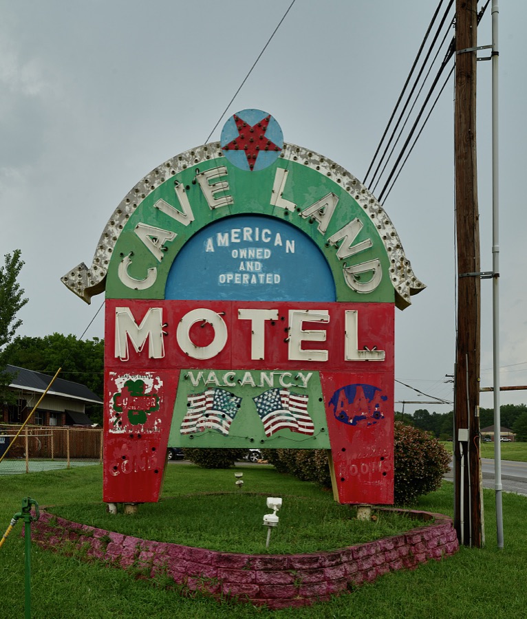 Sign for the Cave Land Motel in tiny Cave City, Kentucky, home to a number of vintage hostelries for weary traveling families near Mammoth Cave National Park, one of the earliest tourist attrations in America
