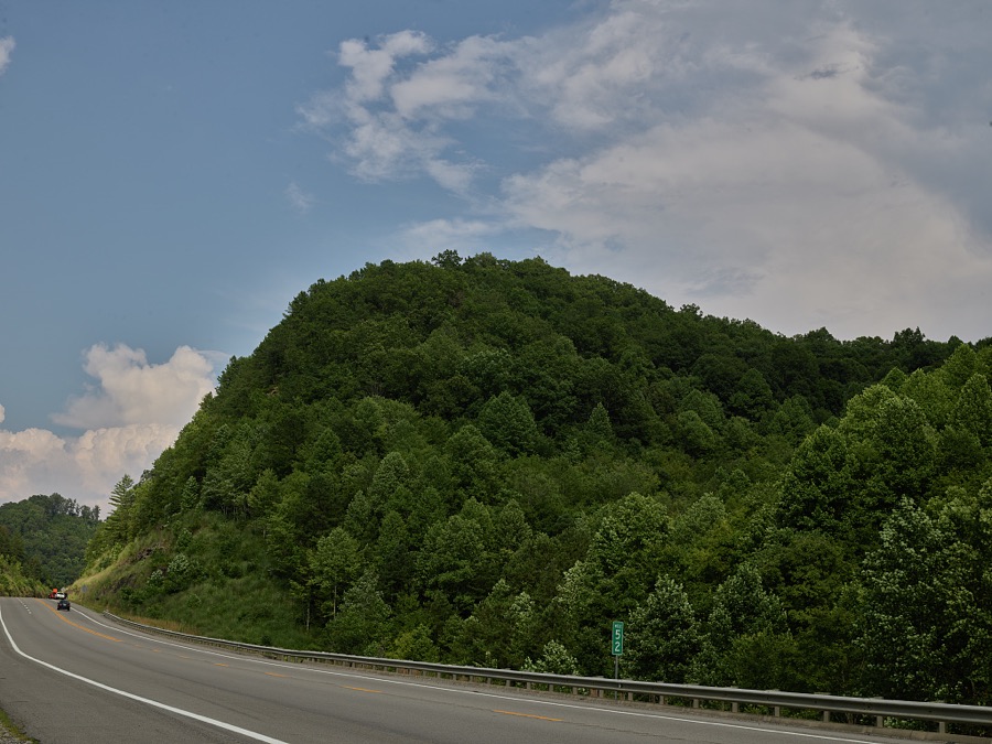 Curve through a cut in the mountains outside Hazard, a coal town of 4,500 or so population in southeastern Kentucky