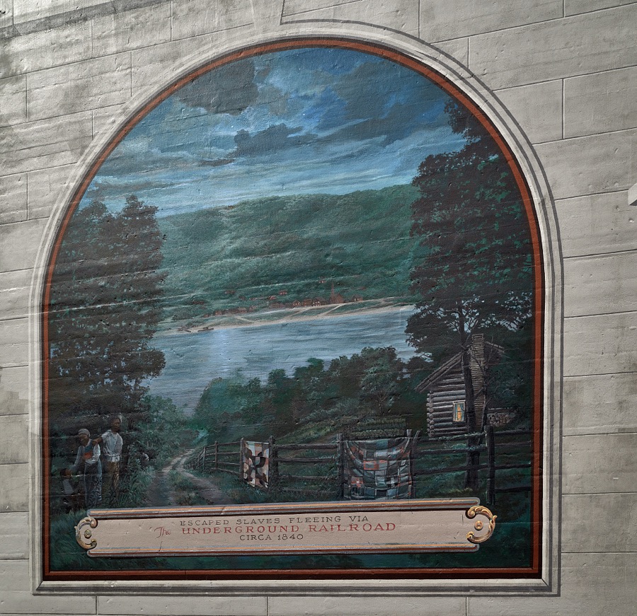 A mural remembering the Underground Railroad, one of 10 panels painted by artist Robert Dalford and his team on panels along the Ohio River floodwall in Maysville, Kentucky