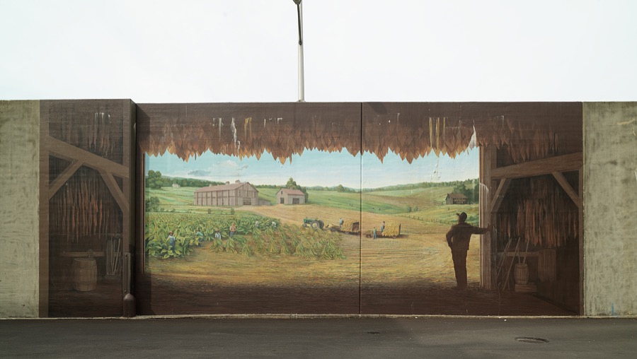 A mural depicting the view from a tobacco barn, one of 10 panels painted by artist Robert Dalford and his team on panels along the Ohio River floodwall in Maysville, Kentucky