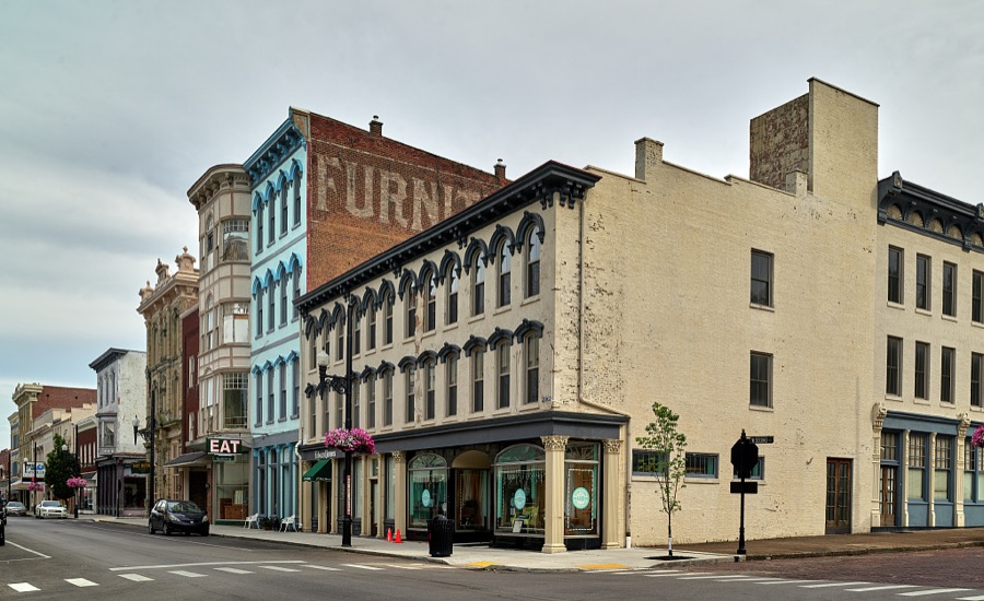 Street scene in Maysville, Kentucky, an Ohio River port city that, although home to fewer than 10,000 people, was several times a boomtown, shipping coal from mines to the south, so much tobacco that it ranked second in the world in looseleaf variety shipments, and wrought iron that decorated fashionable balconies as far away as New Orleans, Louisiana's, French Quarter