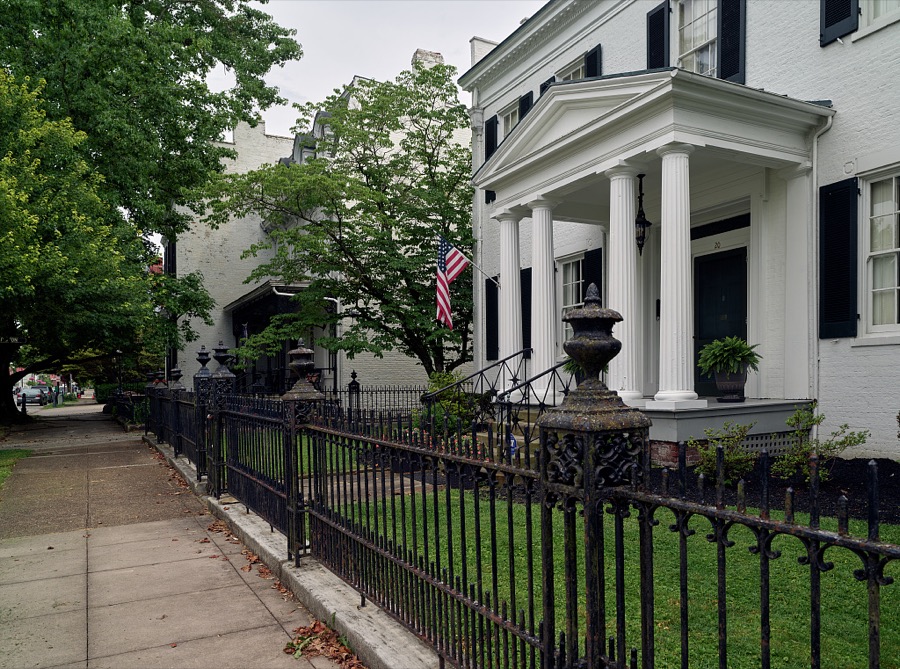 A fine home protected by a classic wrought-iron fence in Maysville, Kentucky, an Ohio River port city that, although home to fewer than 10,000 people, was several times a boomtown, shipping coal from mines to the south, so much tobacco that it ranked second in the world in looseleaf variety shipments, and wrought iron that decorated fashionable balconies as far away as New Orleans, Louisiana's, French Quarter