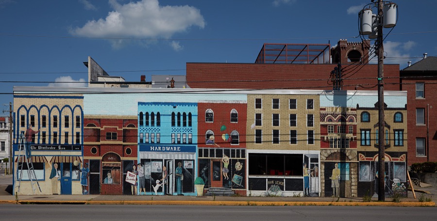 A wall-to-wall mural that looks like an actiual city block in Winchester, a community in northeastern Kentucky
