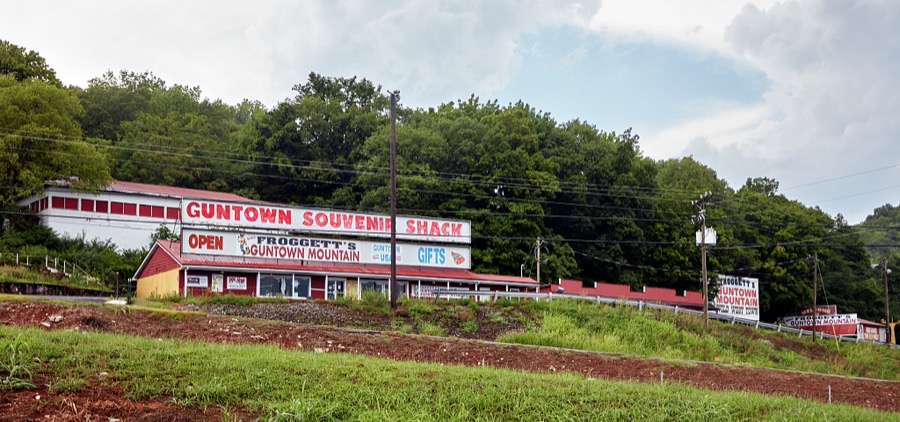 The Guntown Souvenir Shack atop what the proprietor calls "Froggett's Guntown Mountain" in tiny Cave City, Kentucky, which is also home to a number of vintage hostelries for weary traveling families near Mammoth Cave National Park, one of the earliest tourist attrations in America