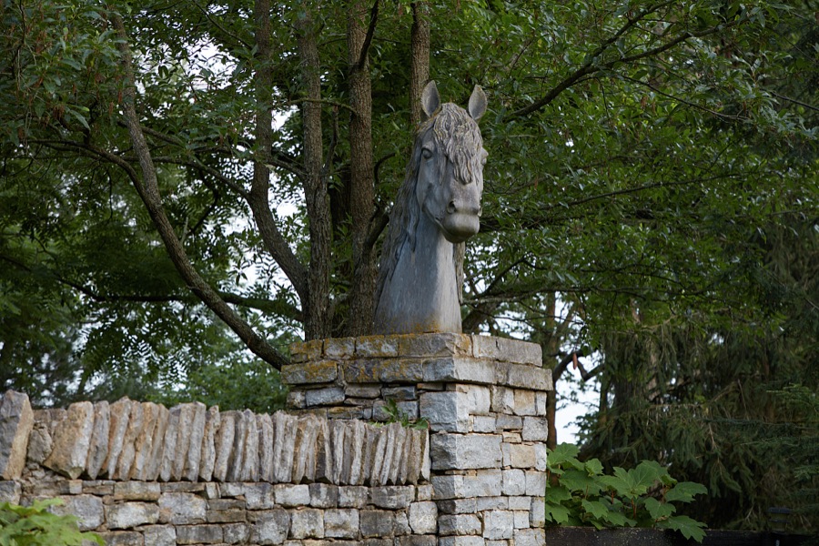Horse figure atop a stone fence, built in 1863, at Stonewall Farm, a thoroughbred racehorse breeding farm outside Versailles, Kentucky