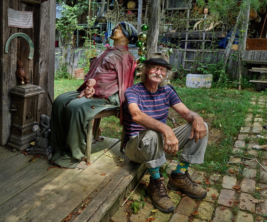 Cecil Ison and "friend" at a most unusual folk-art installation, the "Home for Wayward Babydolls" in the Rowan County, Kentucky rural settlement of Elliottsville, near Morehead