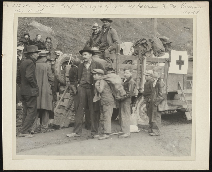 "Going to eat hearty this evenin'" grinned these small boys, as they shouldered Red Cross rations up at Betsy Lane [i.e. Layne] camp, Floyd County, in the mountains of Kentucky. The Red Cross chapter took the supplies up by truck load, as the community is very isolated, and starvation threatened its inhabitants