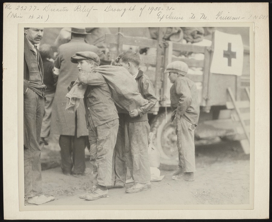 "Going to eat hearty this evenin' " grinned these small boys, as they shouldered Red Cross rations up at Betsy Lane [i.e. Layne] camp, Floyd County, in the mountains of Kentucky. The Red Cross chapter took the supplies up by truck load, as the community is very isolated, and starvation threatened its inhabitants