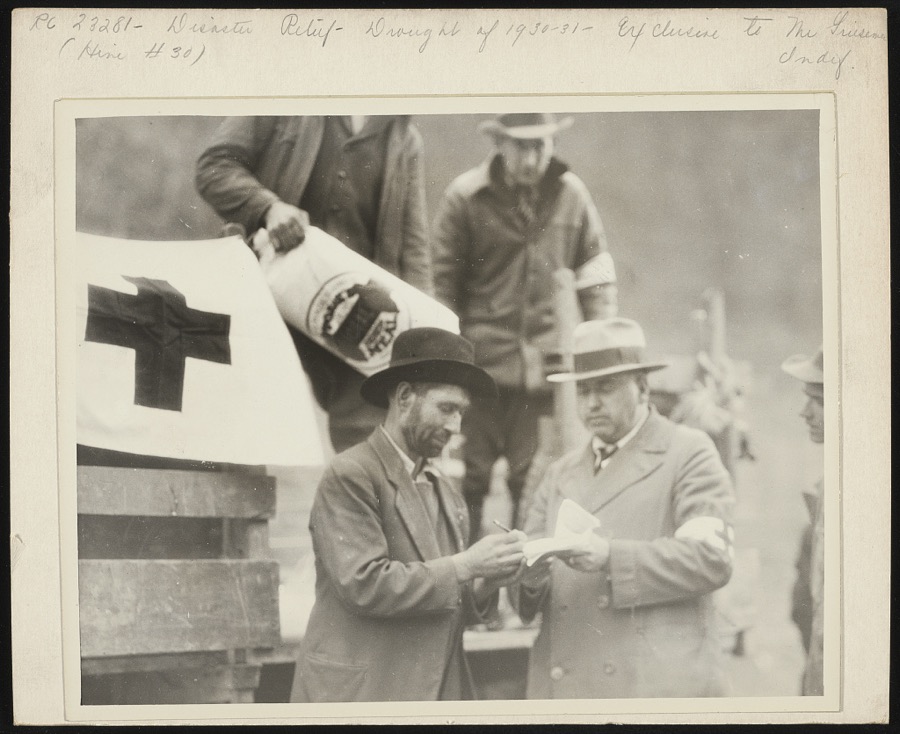 Chapter officers checking foodstuffs they had brought up in trucks to feed mountain folk around Betsy Lane [i.e. Layne], Ky