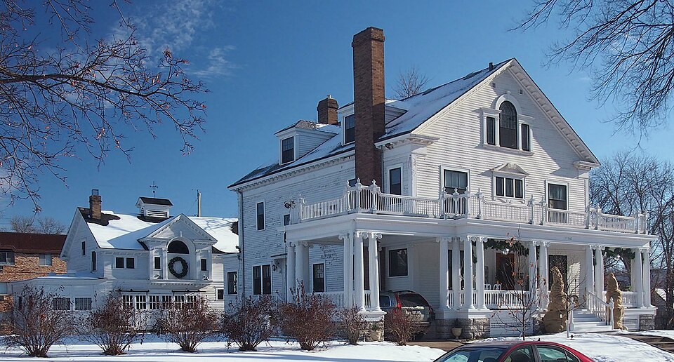 Photograph of John G. and Minnie Gluek House and Carriage House