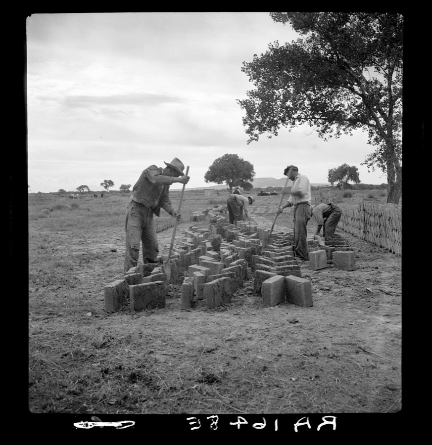 Making adobe bricks. Bosque Farms project, New Mexico. These bricks are to be used in construction of the new school building