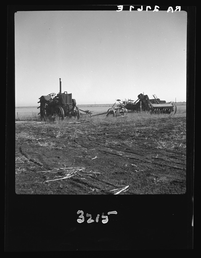 Discouraged farmers have been leaving this area over a period of years, leaving their heavy equipment in the fields. Mills, New Mexico