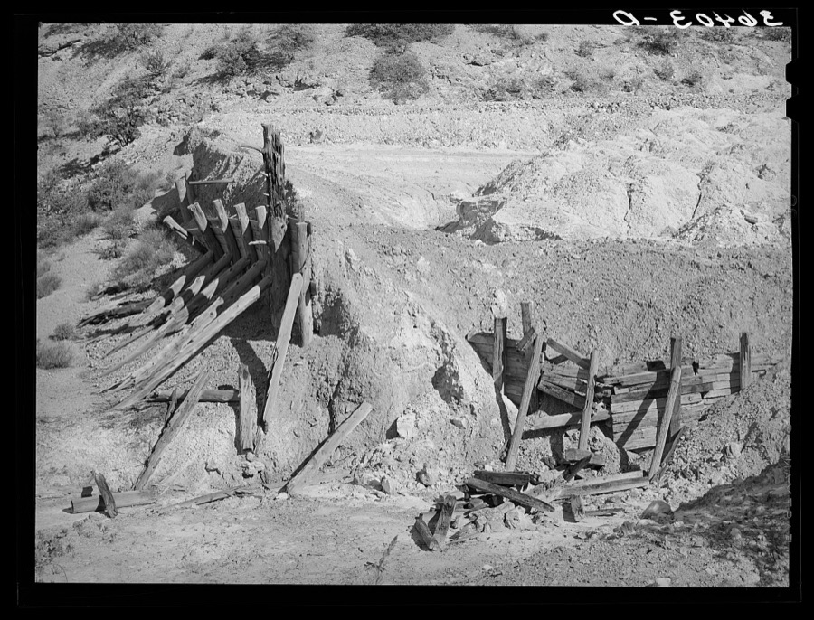 Remains of timber support and tailings of abandoned copper mine at Leopold, New Mexico