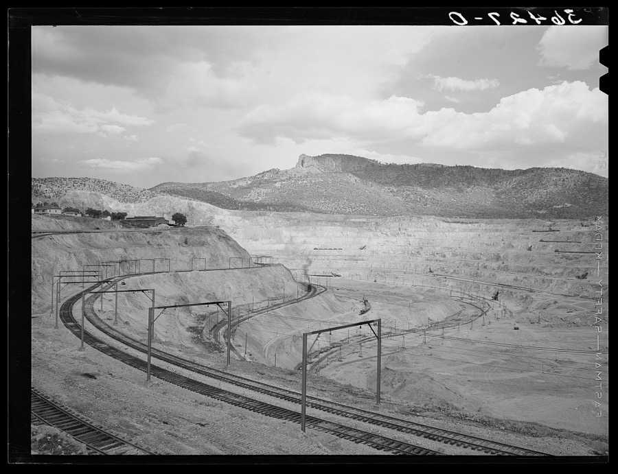 Largest open pit copper mine in the world at Santa Rita, New Mexico. Copper was discovered here by an officer of the Spanish army in 1800 who sold the same to a wealthy Spanish merchant. Pure native copper was transported by pack mule to Mexico City to enter the royal mint for coinage. In 1900 a young mining engineer became interested in the development and was instrumental in the ultimate success of the Chino Copper Company. The ore is now shipped to Hurley, a short distance to the south, where it is put through a five million dollar smelter