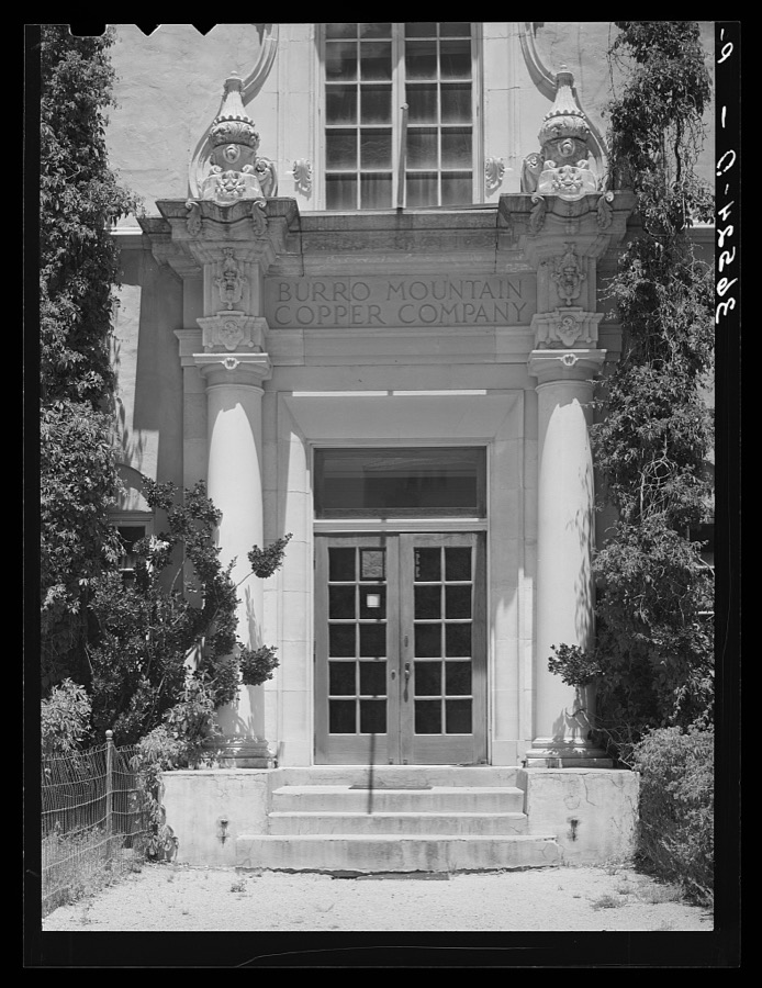 Entrance to offices of Burro Mountain Copper Company. Tyrone, New Mexico. This copper company is no longer actively engaged in mining in this section but is attempting to make the town with its company housing into a summer resort
