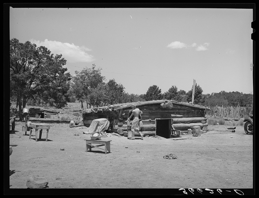 Mr. and Mrs. Caudill moving furniture from their dugout. Pie Town, New Mexico
