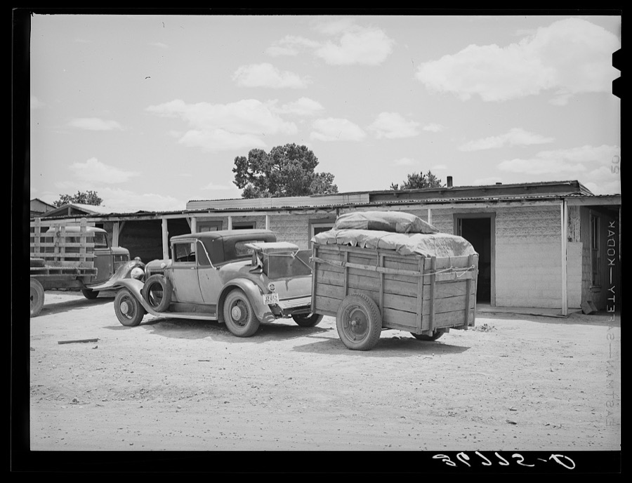 Car and trailer belonging to family coming through Pie Town, New Mexico, in search of work in the tie-cutting camp
